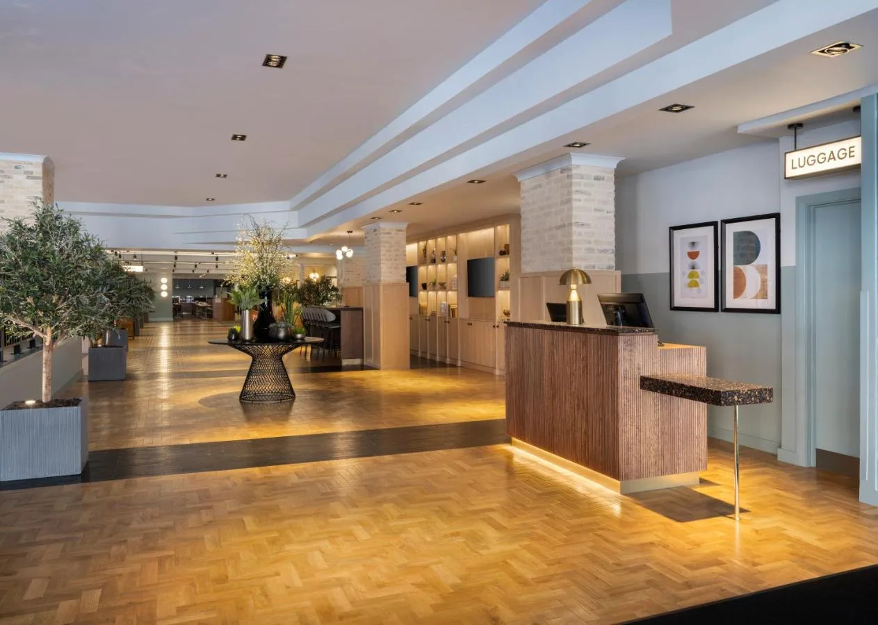 Reception desk in the lobby at Leonardo Royal Hotel Birmingham on Broad Street