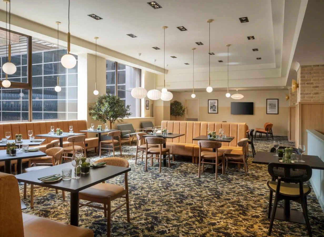 Restaurant with tables and windows at Leonardo Royal Hotel Birmingham