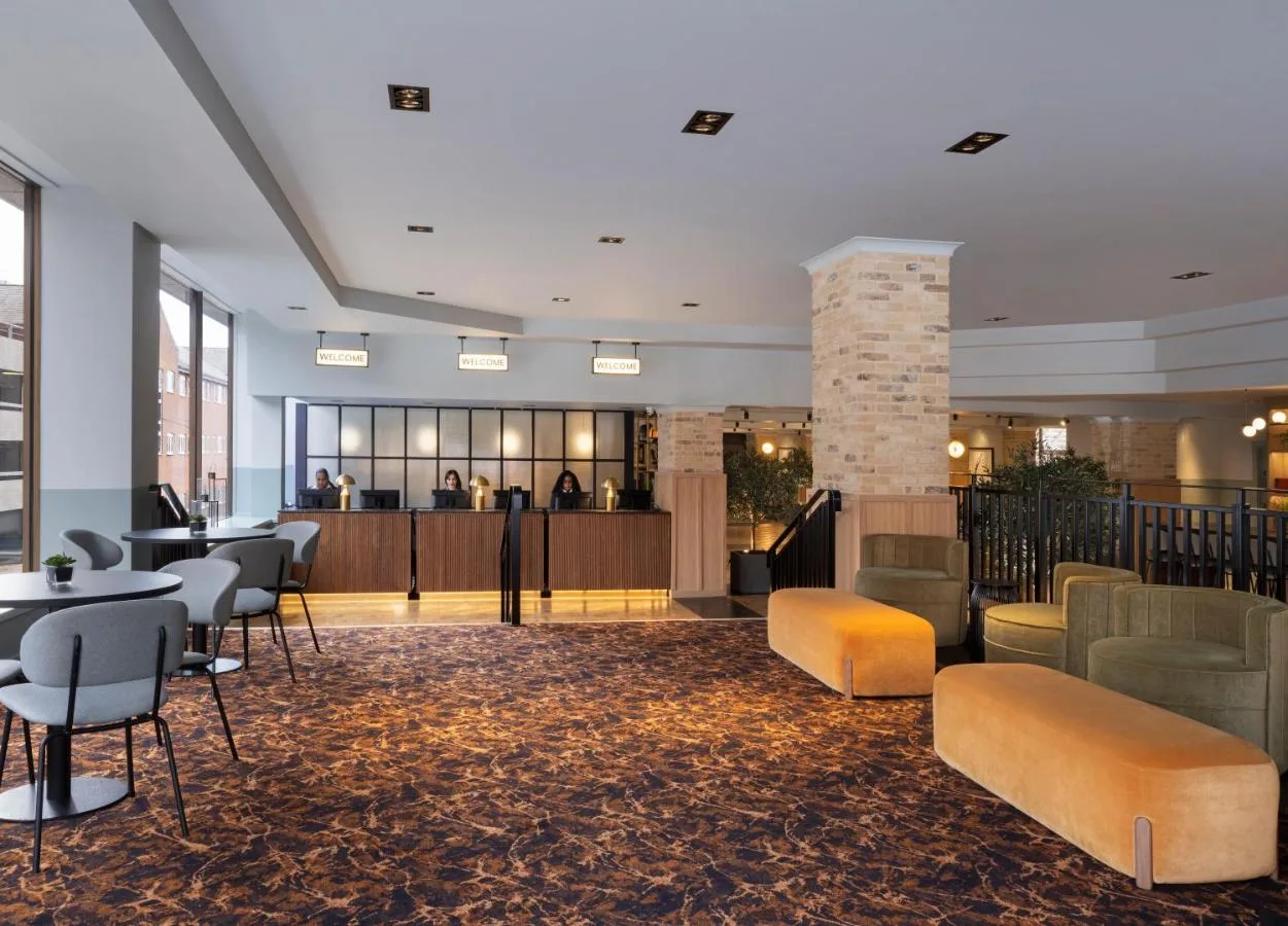 Lounge with bar and seating at Leonardo Royal Hotel Birmingham